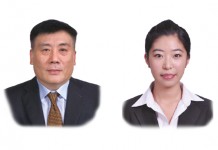 A photo of Li Dongming who is a partner and Yang Lu who is a trainee lawyer at East & Concord Partners
