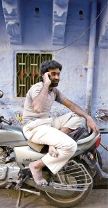 Man_with_mobile_on_motorbike
