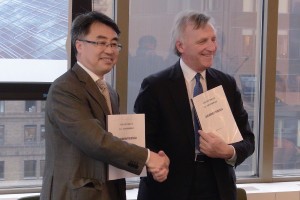 Guo Junxiu (left), CEA’s general counsel, and James Colihan (right), Baker McKenzie’s New York managing partner, signed the agreement