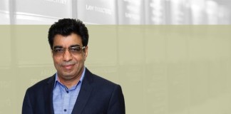 A photo of Deepak Sabharwal on an article about commercial courts act