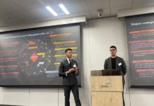 From left to right PwC leaders Eric Chin (left) and Alex Rosenrauch discuss generative AI with attendees.