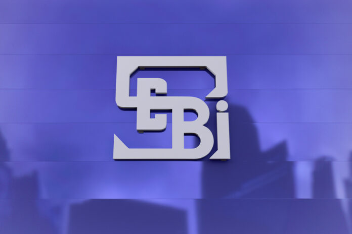 Hindenburg-alleges-SEBI-chair-held-stake-in-Adani-linked-funds Adani-Hindenburg Conflict SEBI Chair