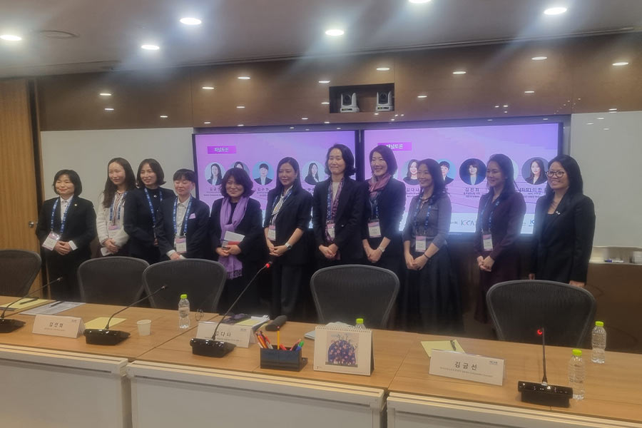 Attendees pose for a group photo following the seminar